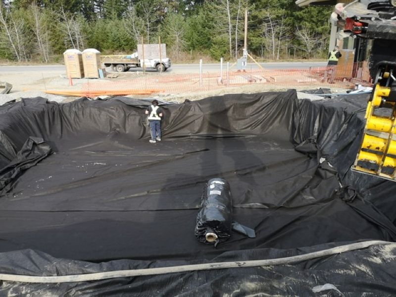 black plastic tarping over site