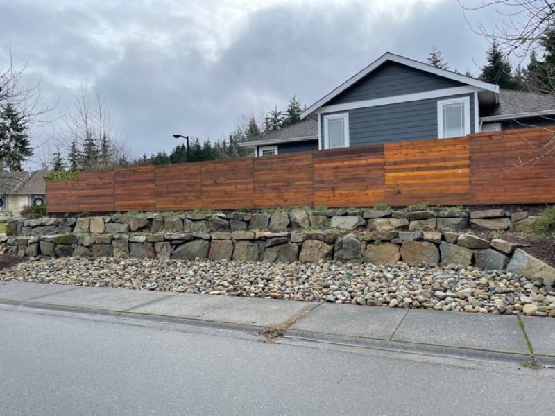 rock wall under residential fence